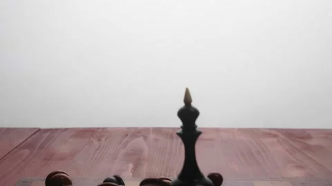The chess Black Queen stands on a chessboard, surrounded by the rest of the lyin Stock Footage 233031388