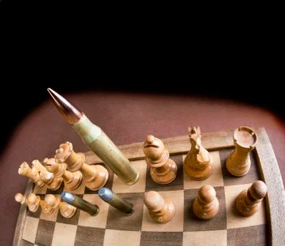 Chess Board and Bullets. Stock Photos