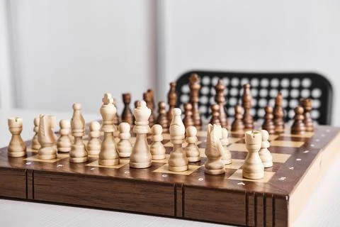 Chess board with chess pieces on table. Everything is ready for game battle Stock Photos