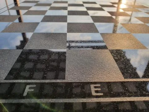 Chess board engraved on a granite table Stock Photos