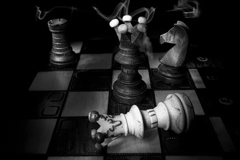 Chess board with figures. Game over. DE Stock Photos