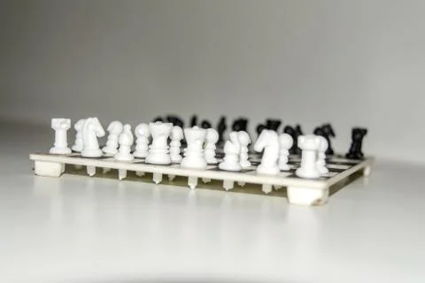 Chess board with figures on isolate white background. Stock Photos