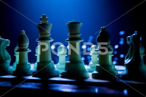 Chess board game concept of business ideas and competition. Chess figures on Stock Photos