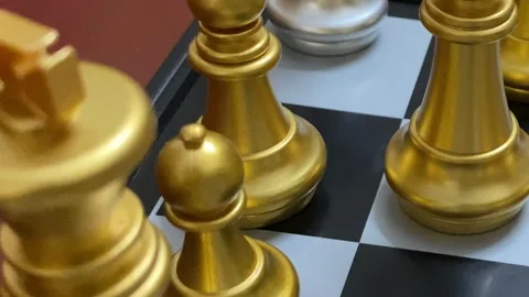Chess board layout with gold and silver game pieces - close up shot. Video stock 333183393