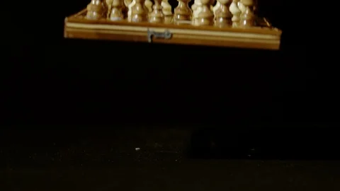Chess board with pieces falling, Ultra Slow Motion Stock Footage 86576329