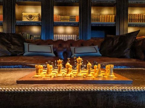 A chess board in a well decorated modern interior Stock Photos