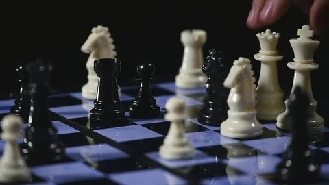 Chess figures on a dark background with smoke and fog. Epic chess