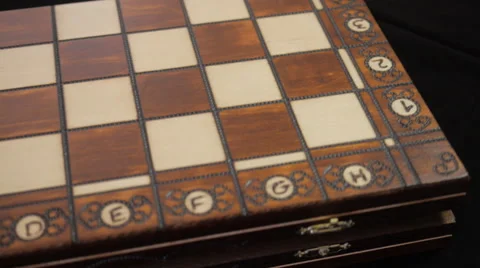 Chess. Box of chessmen. Chess pieces. Open the cover of the chess box Board. Stock Footage 40586943