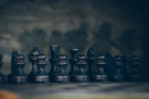Chess casts a shadow on the wall, black pieces made of wood Foto stock