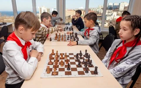Chess competition among kids in chess club. Education, chess and mind games. Stock Photos