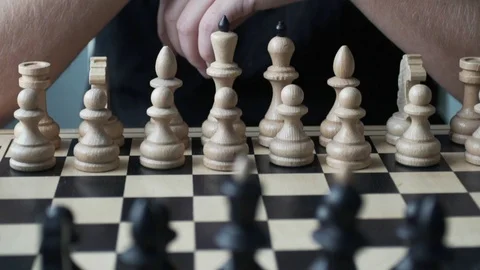 Chess competitions. The player makes the first move Stock Footage 96092972