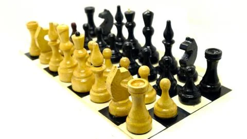 Chess confrontation on a light background Stockfoto's