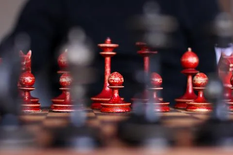 Chess in defocus. White figures. Stock Photos
