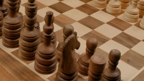 Chess figures on a board spinning Stock Footage 147916197