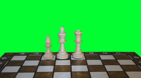 Chess figures form on chess board and prepare to battle on greenscreen backgroun Stock Footage 23828127