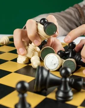 Chess figures in the hands of a person Stock Photos