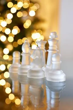 Chess figures made of glass on the table. Foto stock