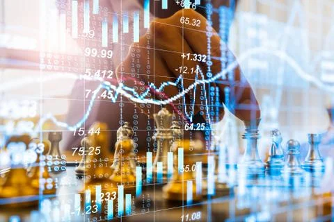 Chess game on chess board on stock market or forex trading graph chart for fi Stock Photos