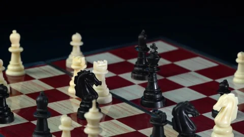 Chess game. Man making move with white bishop on chessboard during chess game Stock Footage 161965731