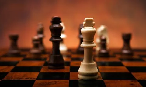 Chess game with pieces on the table Stock Photos