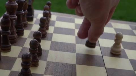 Chess game, playing chess, intelligence, board game, outdoors, recreation Stock Footage 262680580