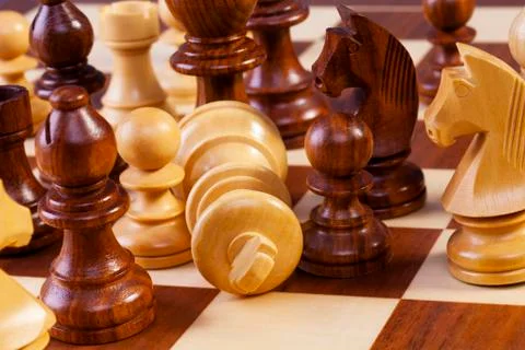 Chess game in progress fallen king Stock Photos