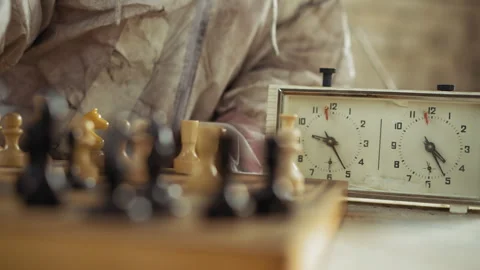 Chess Game Scene with Focus on Timer and Player in Protective Outfit Stock Footage 317984775