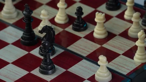 Chess game. Stretegy concept. Close up of businessman hand moving white queen Stock Footage 188457932