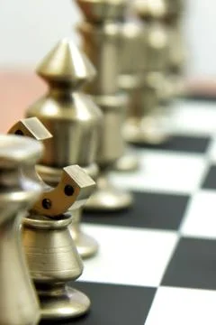 Chess game - view of playing pieces on chessboard Stock Photos