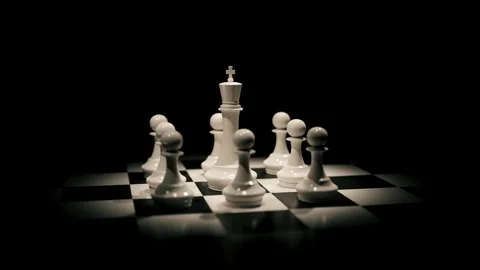 Chess king and pawns on a dark board with cinematic camera movement Stock Footage 342135776