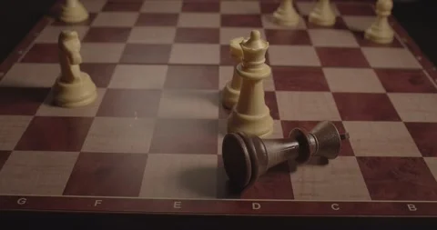 The chess king falls on the chessboard. End of the game, loss. Видео 142889410