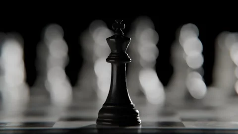 Chess King Piece Standing on Board with Other Blurred Pieces in Background 库存影片 331109940