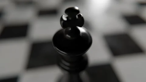 Chess King Piece Standing on a Checkered Board During a Game Strategy Session 库存影片 331109947