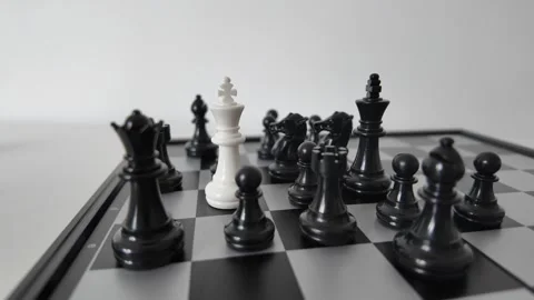 Chess King Surrounded by Opponent Pieces in Checkmate Concept Stock Footage 339660248