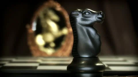 Chess knight sees himself in the mirror stallion Stock Footage 16314323