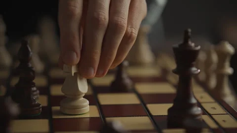 The chess master makes a move with a chess piece and a knight. Close-up of a Stock Footage 275093963