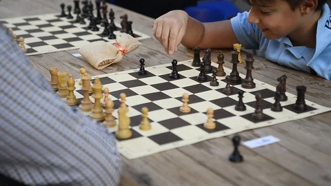 Chess match between father and son Stock Footage 88817098