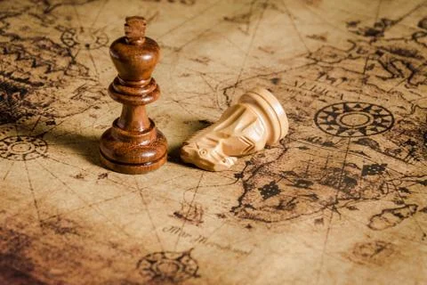 Chess on old map  Stock Photos