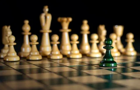 Chess: one against all, attack on power (out of focus) Stock Photos
