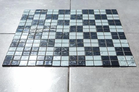 Chess or checker board made with pieces of glass, some broken Stock Photos