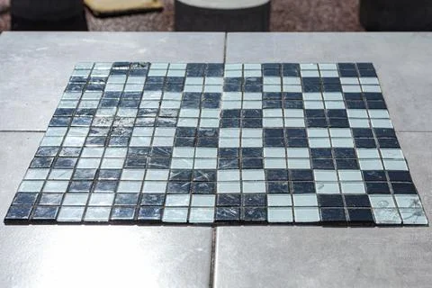 Chess or checker board made with pieces of glass, some broken Foto stock