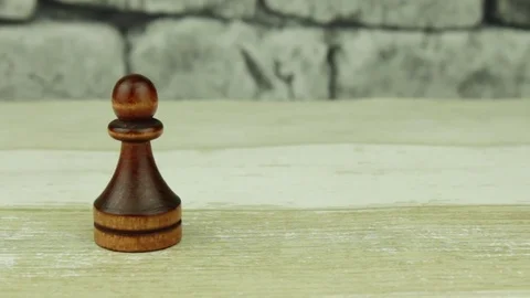 Chess pawn on a brick background Stock Footage 78221598