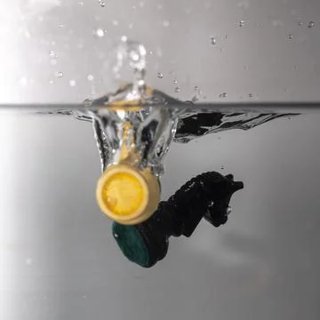 Chess piece drop in water Stock Photos