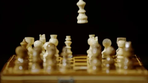 Chess piece falling on a chess board, Ultra Slow Motion Stock Footage 86576325