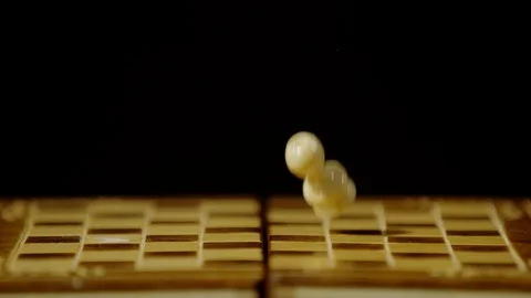 Chess piece falling on chess board, Ultra slow motion Stock Footage 86577211