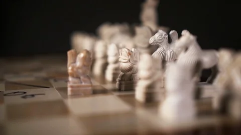 Chess piece form lion closeup move male hand to opponent on chessboard slow mo. Stock Footage 119347704