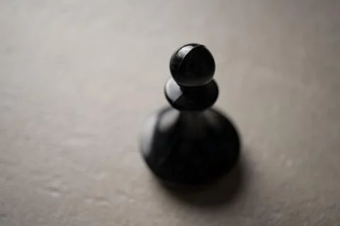 Chess piece Pawn close-up on a light background Фото