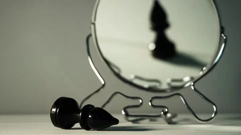 A chess piece is reflected in the mirror. Things are not what they seem. Video stock 143632255