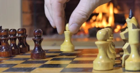 Chess pieces on the background of the fireplace. Stock-Footage 110692165