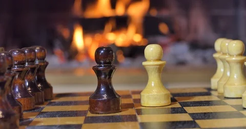 Chess pieces on the background of the fireplace. Video stock 110692185